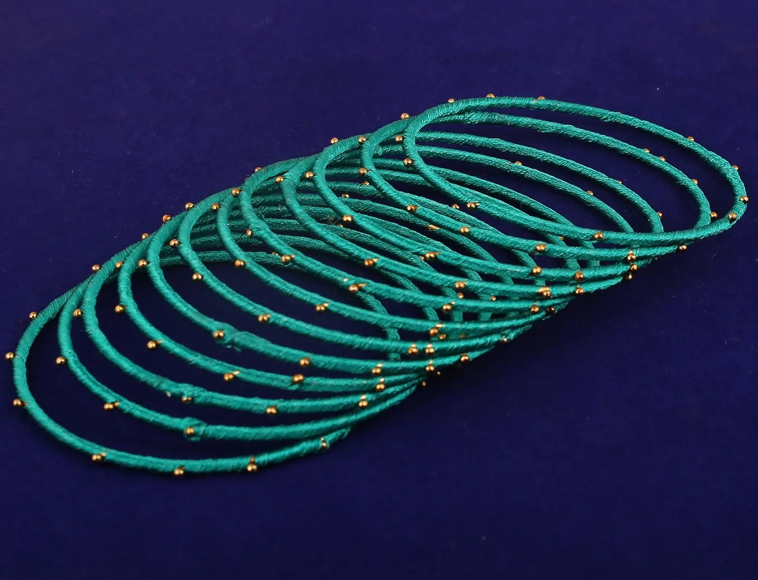 Touchstone Indian Bollywood Mystical Look Hand Woven Faux Silk Thread Golden Balls Gorgeous Color Exotic Designer Jewelry Bangle Bracelets for Women.